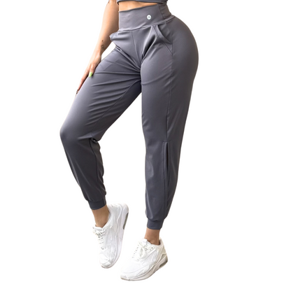 Pans Deportivos para Mujer Fitness: Efecto Básico, Cintura Alta, Con Bolsillos Laterales, Textil Lycra Transpirable con Acabado Liso, Color Gris | Adriana Olimpo