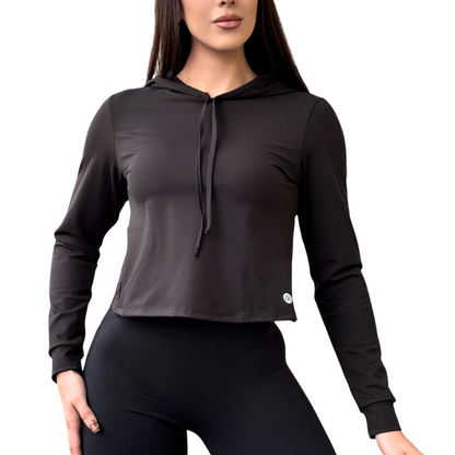 Sudadera Deportiva para Mujer Fitness: Manga Larga con Capucha, Textil Lycra Suave Transpirable con Acabado Liso, Color Negro | Adriana Olimpo.