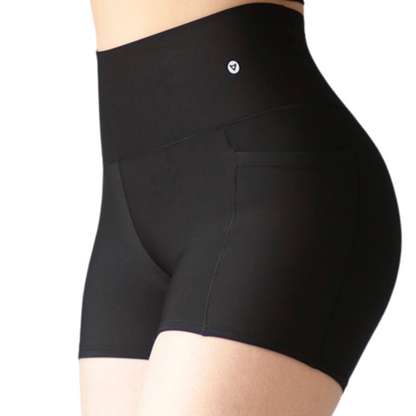 Short Mini Deportivos para Mujer Fitness: Efecto Básico, Cintura Alta, Con Bolsillos Laterales, Textil Lycra Transpirable con Acabado Liso, Color Negro | Adriana Olimpo